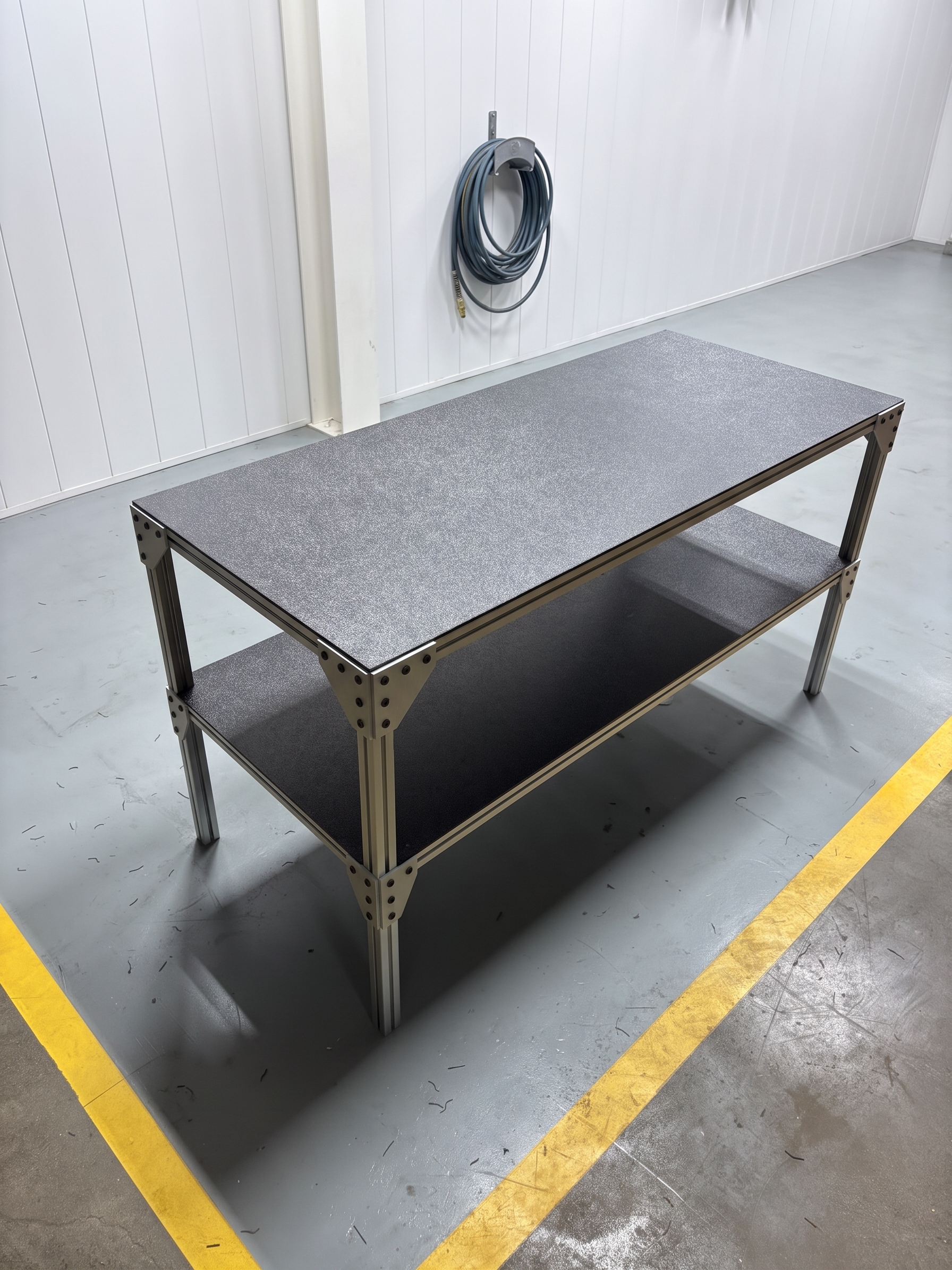 Two-level aluminum extrusion workbench built by High Grade Systems