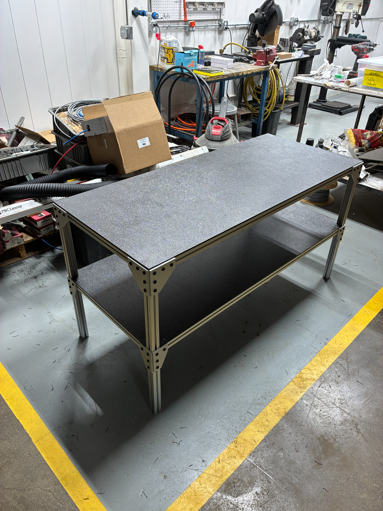 A High Grade Systems extrusion table with lower shelf, built in our shop